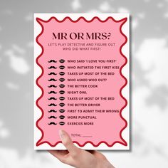 a hand holding up a pink card with the words, mr or mrs?