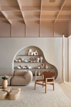 a living room filled with furniture and shelves