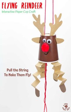 a paper cup that has been made to look like a reindeer hanging from a string