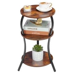 two tiered wooden table with books and cup on top