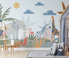 a child's room with a wall mural featuring giraffes and zebras