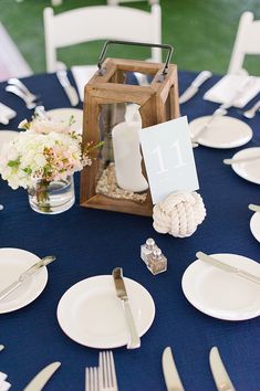 the table is set with plates, silverware and napkins for an elegant wedding reception