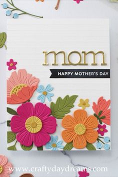 a mother's day card with flowers on it