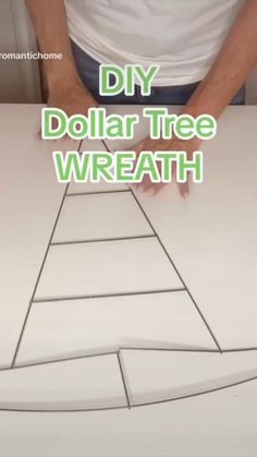 someone is making a paper tree with the words diy dollar tree wreath on it