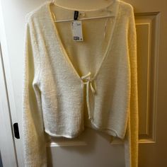 Fuzzy White Tie Cardigan. Size L Never Worn-Tags Still Attached (Very Soft) Fuzzy White Cardigan, White Soft Knit One-size Cardigan, White V-neck Cardigan For Daywear, Vintage White V-neck Cardigan, White V-neck Cardigan With Pockets, Tie Cardigan, White Tie, White Sweaters, Sweaters & Cardigans