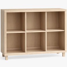 a wooden shelf with four compartments on one side and three shelves on the other end