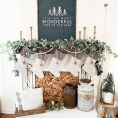 a fireplace with christmas decorations on it and a sign above the fire place that says wonderful time of the year