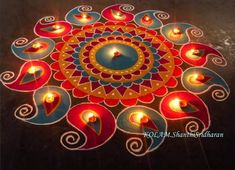 a colorful rangdi with lit candles on the ground