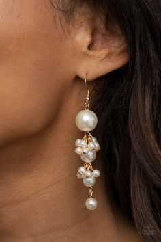 Clusters of dainty white pearls trickle along a glistening gold chain that delicately links together a bubbly strand of pearls. The classic pearls gradually decrease in size, creating a timelessly tasseled display. Earring attaches to a standard fishhook fitting. Sold as one pair of earrings. Strand Of Pearls, Droplet Earrings, Pearl Cluster, Gold Pearl Earrings, Fish Hook Earrings, Paparazzi Accessories, Paparazzi Jewelry, Bride Jewellery, Gold Pearl