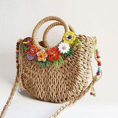 Handmade braided shoulder bag, with double handle and removable shoulder strap 1 meter long. Closure by cord. Inner lining with pocket.Decorated with acryl flowers that give it a very colorful touch, perfect to show off this summer!External dimensions in cm: 27 x 24 x 8 Care and maintenanceThis delicate piece has been created with a lot of dedication and love, and we hope it will become one of your favourites. Please, do not let it come into contact with water or other substances that can deteri Trendy Flower Shaped Bag For Beach, Handmade Flower-shaped Bag For Vacation, Trendy Flower-shaped Beach Bag, Spring Braided Crochet Shoulder Bag, Handmade Flower Shoulder Bag For Beach, Bohemian Beach Bag With Handles For Spring, Spring Beach Crochet Bag With Detachable Handle, Bohemian Spring Beach Bag With Handles, Bohemian Everyday Flower Shoulder Bag