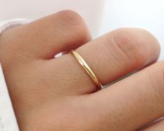 Classic and beautiful. This thick gold band is handcrafted in high-quality 14k solid gold material and made to order just for you. Wear this band alone or stack it with other dainty rings for a stacked looked! Handmade in Los Angeles, CA! Packaging: Comes in a gift box, ready for gift-giving! Ring Size: Width: 2mm Thickness: 1mm Material: 14k Solid Gold (not filled, plated or vermeil) *High-end hand polish Benefits of 14k Solid Gold Jewelry: 1. Superior metal and long lasting 2. Radiant color an 14k Rose Gold Wide Band Wedding Ring, Gold Wide Band Stackable Ring For Wedding, Gold Stackable Wide Band Ring For Wedding, Minimalist Yellow Gold Wide Band Wedding Ring, Minimalist Wide Band Wedding Ring In Yellow Gold, Minimalist 14k Gold Wide Band Ring For Wedding, Minimalist 14k Gold Wide Band Wedding Ring, Rose Gold 14k Wide Band Ring For Wedding, Rose Gold Wide Band Ring For Wedding