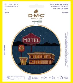 the cross stitch pattern is shown with an image of a motel sign in front of it