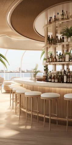 a bar with stools and shelves filled with bottles on the wall next to water