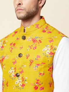 This digital print-on mustard linen bundi jacket is perfect for your next summer event. It features front buttons fastening, and a mandarin collar. The floral mustard bundi jacket is made of cotton material.
Style Tip: Pair it with a blue shirt and white jeans.
NOTE: Ready-to-Ship in Size L