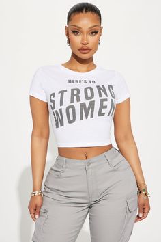 Available In White. Crew Neck Short Sleeve Front Screen Stretch Disclaimer: Due To The Specialized Screen Printing Process A Difference In Saturation May Occur. Each Garment Is Unique. 65% Cotton 35% Cotton Imported | Here's To Strong Women Tee Shirt in White size 3X by Fashion Nova Text Print Stretch Crop Top, Stretch Text Print Crop Top, Streetwear Tops With Text Print, Relaxed Fit Text Print Crop Top, Relaxed Fit Slogan Tops, Casual Slogan Tops, White Crew Neck, Makeup Makeover, Ladies Tee Shirts