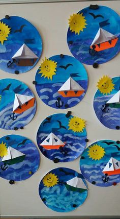 paper plates with boats and sun on them