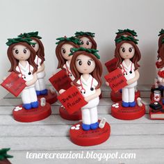 a group of figurines with nurses holding books