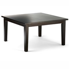 a black table sitting on top of a white floor