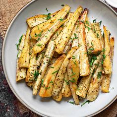 roasted parsnips on a white plate with the text vegan i gluten free