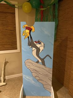 the lion and the mouse painted on an easel in a child's room