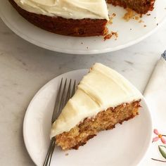 two plates with slices of carrot cake on them