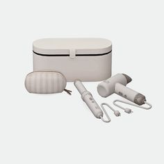 an electric hair dryer and other items are shown in this image on a white background