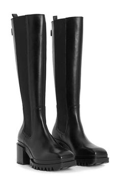 A lug sole and block heel exaggerate the retro appeal of this look-defining knee-high boot. 2 1/2" heel 15 3/4" shaft; 14" calf circumference Pull-on style with elastic gore insets Leather upper and lining/synthetic sole Made in Portugal Fall Wardrobe Essentials, Womens Riding Boots, Knee Boot, Riding Boot, Baby Boy Shoes, Boy Shoes, Lug Sole, Toddler Girl Outfits, All Saints