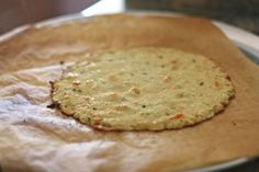 a tortilla sitting on top of a piece of wax paper