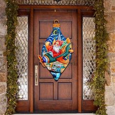 a christmas ornament on the front door of a house