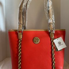 Giani Bernini Hand Bag Color: Chili Pepper Description: Keep Your Essentials Secure With Smart Storage Features. It’s The Perfect Blend Of Form, Functionand Fashion! *Measures 14”Hx9.25”Dx4.75” W 1.83lb *Center Divider Zipper,Magnetic Snap Closure Interior:2 Slip Pockets,1 Zipper Pocket,1 Id Window *Exterior:1 Back Slip Pocket,Hardware Logo And 2 Piece Pleating On Front Panel. *Interior: 2 Slip Pockets,1 Zipper Pocket,1 I.D Window. *Handle 9” L Drop Smartphone Pocket Organizer Pockets Red Bags With Braided Handles, Elegant Red Shoulder Bag With Braided Handles, Window Exterior, Messanger Bag, Hardware Logo, White Shoulder Bag, Holiday Bag, Pocket Organizer, Brown Tote