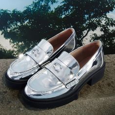 New Authentic Coach Metallic Silver Loafers Size 7 These Statement Loafers Are To Die For! They Are The Perfect 90s And Y2k Fashion Silver Chunky Loafers Have A 1 1/2 Inch Treaded Rubber Heel And Sole. Superior Comfort And Coach Leather Durability They Will Last Forever! New In Box* Out Of Stock On Coach Website* Summer Office Platform Loafers With Round Toe, Modern Silver Loafers With Round Toe, Summer Formal Platform Loafers, Spring Patent Leather Loafers With Brogue Detailing, Silver Flat Loafers For Work, Silver Round Toe Loafers For Work, Spring Loafers With Metal Feet & Round Toe, Coach Loafers With Leather Sole For Work, Silver Slip-on Loafers For Office