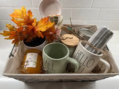 a tray filled with coffee mugs and other items