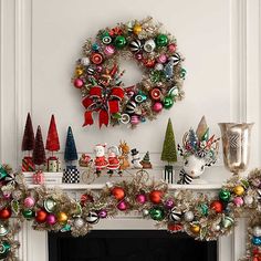 a fireplace mantel decorated with christmas decorations