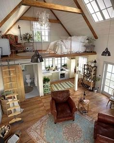 an aerial view of a living room, kitchen and bedroom in a loft style home