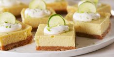 several pieces of cheesecake with cucumbers on top