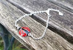 "This bracelet is perfect for anyone! It has a red and black ladybug charm. The metal is a silver color. The charm part measures 3/4\" long and 1/2\" wide. The bracelet has an extender on it and a heart charm at the end. Perfect for a wedding, for a Christmas gift, anniversary, or a birthday. Perfect for mom! All jewelry items come in a gift box." Silver Novelty Charm Bracelet For Birthday, Red Nickel-free Charm Bracelet For Gift, Red Nickel-free Charm Bracelet As Gift, Bug Bracelet, Ladybug Bracelet, Ladybug Jewelry, Black Ladybug, Memory Locket, Metal Charm