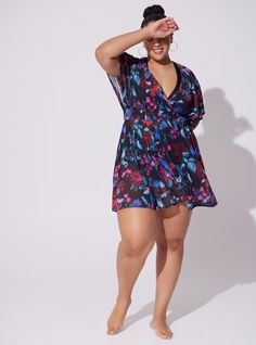 FIT Model is 5'7”, wearing size 1. Size 2 measures 38” from shoulder. MATERIALS + CARE Mesh knit fabric. . 93% polyester, 7% spandex. Hand wash; dry flat. Imported plus size swimwear. DETAILS Surplice neck. Dolman sleeves. Smocked waist. Floral print. . The best plus size women's mesh smock waist coverup dress surplice & wrap dresses in mystical forest floral-black made of polyspan. This spring dress or summer dress is perfect for Easter, for Mother's Day, to wear as a wedding guest, for brunch, for graduation, and for every day. This sexy dress will show off your confidence for going out to a cocktail party, date night, girls' night out, bachelorette party, hen party, birthday party, or night activity. Torrid is your destination for the freshest spring and summer styles. Torrid is your de Beach Dresses With Elastic Waistband And Stretch, Summer Dresses With Stretch And Elastic Waistband, Stretch Lined Beachwear Dresses, Fitted Dress With Elastic Waistband For Beach, Fitted Beach Dress With Elastic Waistband, Fitted Summer Mini Dress With Elastic Waistband, Knit Beach Dress, Chiffon Cover Up, Coverup Dress