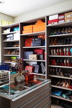 a shoe store filled with lots of different types of shoes and purses on shelves