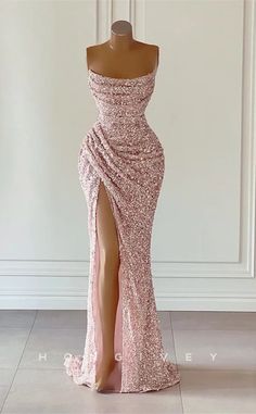 This stunning L1874 Prom Dress is crafted from exquisite sequined material with a ruched bodice and a side slit train. The fitted bateau neckline and strapless design give it a look of sophistication and glamour. Perfect for an elegant evening event. Sequin Prom Dresses Long, Prom Dresses Elegant, Prom Dresses Long Mermaid, Mermaid Prom Dress, Dresses Formal Elegant, Sequin Prom Dress, Evening Party Gowns, Sequin Evening Dresses