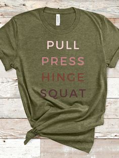 T-Shirt made specifically for women who lift weights Writing: "PUSH, PULL, HINGE, SQUAT" (AKA, the big 4) This classic unisex jersey short sleeve tee fits like a well-loved favorite. Soft cotton and quality print make users fall in love with it over and over again.  Bella Canvas Tee has a retail fit, so it falls and wears more naturally around your body, flowing with the curve of your chest, torso, and hips. The ribbed knit stitching on the collar looks stylish and also keeps the shirt looking f Green Relaxed Fit T-shirt For Workout, Green Graphic Tee For Workout, Comfortable Cotton Training T-shirt, Graphic Tee Tops With Letter Print For Training, Workout Crew Neck Tops With Screen Print, Athleisure Workout T-shirt With Screen Print, Workout Short Sleeve T-shirt, Crossfit Apparel, Crossfit Tshirts