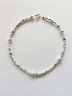 "️🍄 𝓰𝓾𝓶𝓭𝓻𝓸𝓹 𝓰𝓪𝓻𝓭𝓮𝓷 𝓷𝓮𝓬𝓴𝓵𝓪𝓬𝓮 ️🍄 FREE SHIPPING You will receive one necklace as seen in photos. Has a pastel rainbow and white color scheme. Made to order and beaded by me with luvvv <3 Strung on strong cord with a mixture of glass beads!! 🌹 Silver toggle clasp closure. Each necklace is unique with a different bead pattern but will look similar to photos. Looks great alone or layered with our mushroom garden necklace. Necklace variations - please choose when purchasing ( Cute Pastel Jewelry With Round Beads, Cute Pastel Round Bead Jewelry, Cute Pastel Beaded Jewelry, Pastel Beaded Necklaces With Round Beads, Pastel Jewelry With Colorful Beads In Playful Style, Playful Pastel Jewelry With Colorful Beads, Adjustable Pastel Beaded Necklaces, Pastel Beaded Necklaces With Colorful Beads As Gift, Pastel Beaded Necklaces With Colorful Beads For Gifts