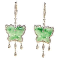 Introducing our captivating Vintage 14.85ct Butterfly Jade and Diamond Dangle Drop Earrings in 18k White Gold. These exquisite earrings exude timeless beauty and grace, combining the elegance of jade and the brilliance of diamonds. The focal point of each earring is a stunning butterfly-shaped jade, boasting a total weight of 14.85 carats. The intricate carving and vibrant green color of the jade create a mesmerizing centerpiece that captures the essence of nature's beauty. Accentuating the allu Jade Butterfly, Intricate Carving, India Jewelry, Butterfly Shape, Green Earrings, Vibrant Green, Drop Earring, Diamond White, Timeless Beauty