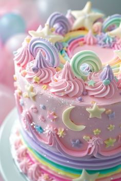 there is a pink cake with stars and swirls on it