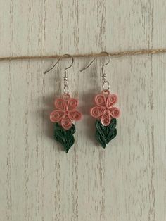 Quilled pink flowe with green quilled stem earrings. Sealed in UV resin for durability. Handmade Pink Flower Earrings, Handmade Flower Jewelry For Crafting, Pink Flower-shaped Necklace With Flower Decoration, Adjustable Pink Flower-shaped Necklace, Pink Adjustable Flower Shaped Necklace, Pink Flower Necklace With Flower Decoration, Handmade Pink Flower-shaped Necklace, Green Flower Earrings For Gifts, Pink 3d Flowers Jewelry For Gift