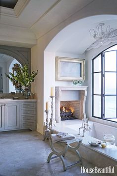 a living room with a fire place next to a window