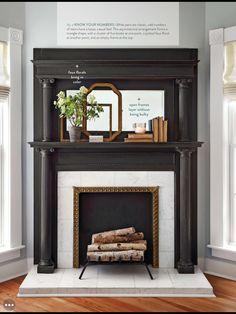 a living room with a fire place and bookshelves on the mantels