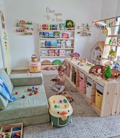 a child playing with toys in a playroom