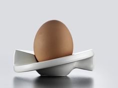 an egg sitting on top of a white plate