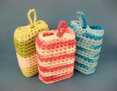 three small crocheted baskets sitting next to each other