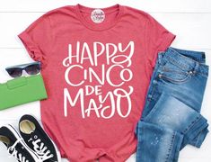 "The \"Happy Cinco De Mayo\" design is high quality commercial heat transfer vinyl that is heat pressed on top of a Bella + Canvas Unisex Short-Sleeve Crew Cotton T-Shirt.  Material: ♥4.2 oz., 100% airlume combed and ringspun cotton, 32 singles ♥Ash is 99% airlume combed and ringspun cotton, 1% polyester ♥Heather Colors: 4.2 oz., 52% cotton/48% polyester Feature: ♥Unisex sizing ♥Shoulder taping ♥Sideseamed ♥Tear away label ♥Pre-shrunk ♥ FIRST START WITH THE SIZE ♥ Select in the drop-down menu wh Mexican Shirt, Fiesta Shirt, Mexican Shirts, Look Plus, Unisex Shorts, Transfer Vinyl, The Happy, Heat Transfer Vinyl, Plus Size Clothing